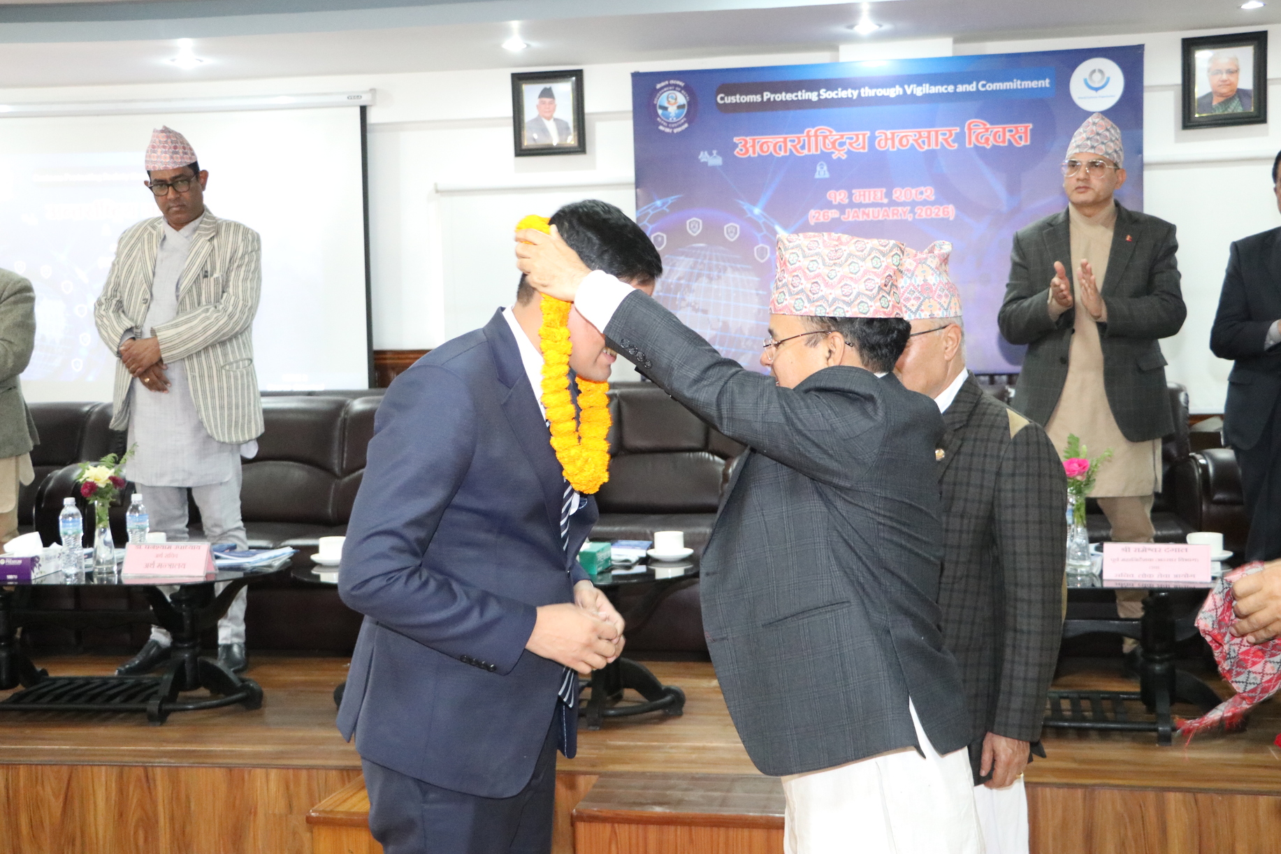 International Trade and Customs expert Mohan Pudasaini Finance Secretary Mr. Ghanshyam Upadhyaya felicitating me with a marigold garland.