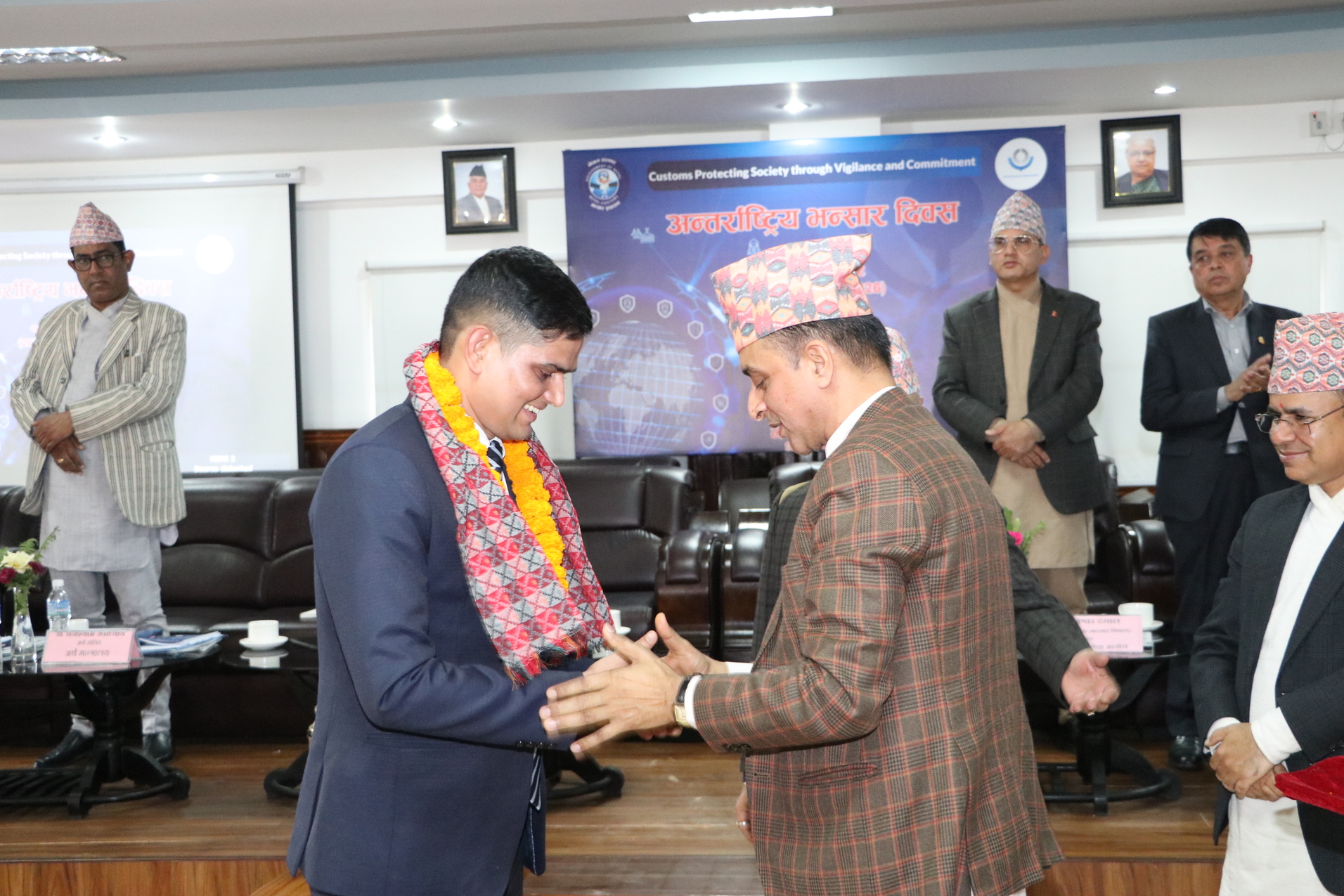 International Trade and Customs expert Mohan Pudasaini Director General of Nepal Customs, Mr. Shyam Prasad Bhandari, congratulating me on the recognition. 